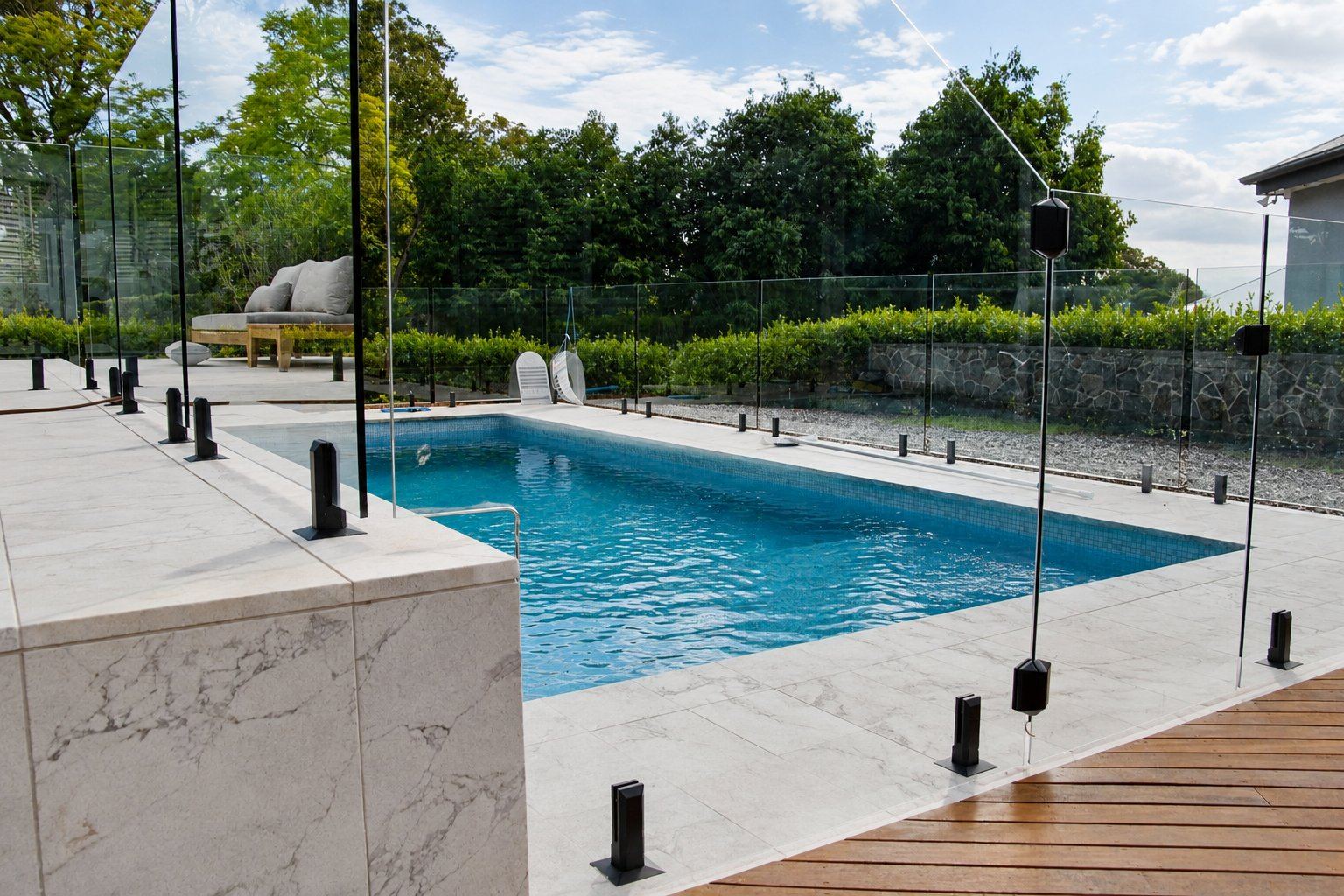 Concrete swimming pool in Lake Macquarie with glass pool fencing